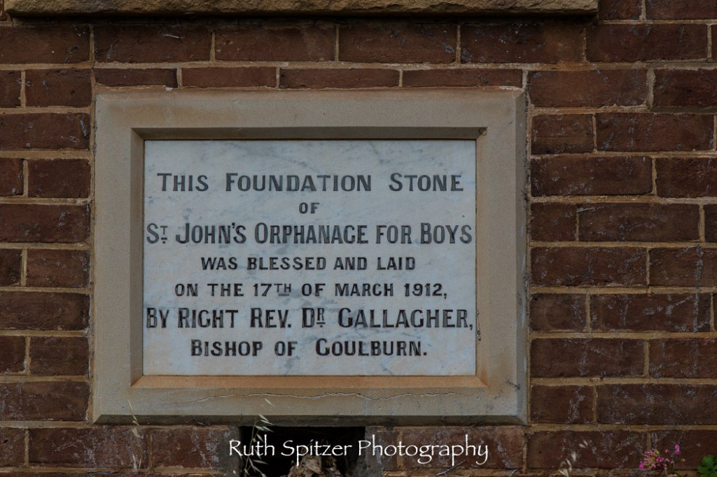 Plaque on the wall of the Abandoned St Johns Orphanage in Goulburn. Image by Ruth Spitzer